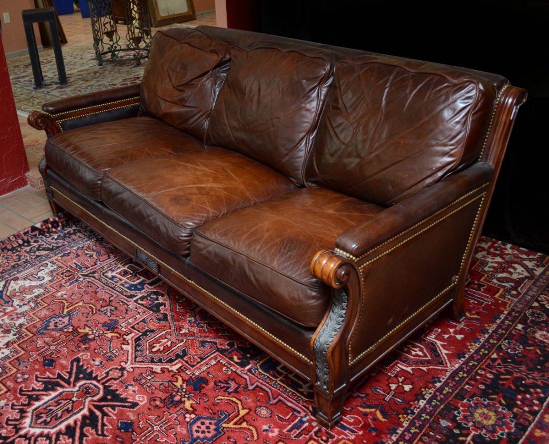 WHITTEMORE SHERRILL BROWN LEATHER SOFA: WHITTEMORE SHERRILL BROWN LEATHER SOFA: Supple brown leather tacked to carved wood frame with applied decoration. Removable seat cushions. Overall 34" h. x 80" x 40".