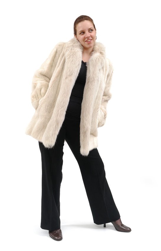 WHITE FOX AND MINK JACKET: WHITE MINK & FOX FUR JACKET: Car coat length white mink jacket trimmed in plush white fox, slit pockets, fitted cuffs, fox pattern lining, Anastasia Furs label. Approx. 33" collar to hem, 24" shoulder