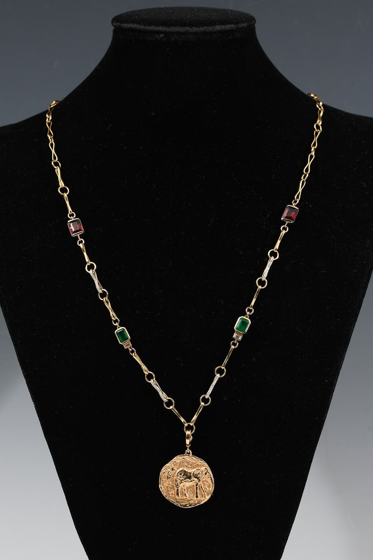 18K AZLEE ELEFANTE MEDALLION W/ CHAIN: 18K AZLEE ELEFANTE MEDALLION W/ CHAIN: 18K yellow gold necklace by (custom made) ?AZLEE? with an Elefante medallion pendant containing: 2- emerald-cut African rhodolite garnets; 2- emerald-cut Zambian
