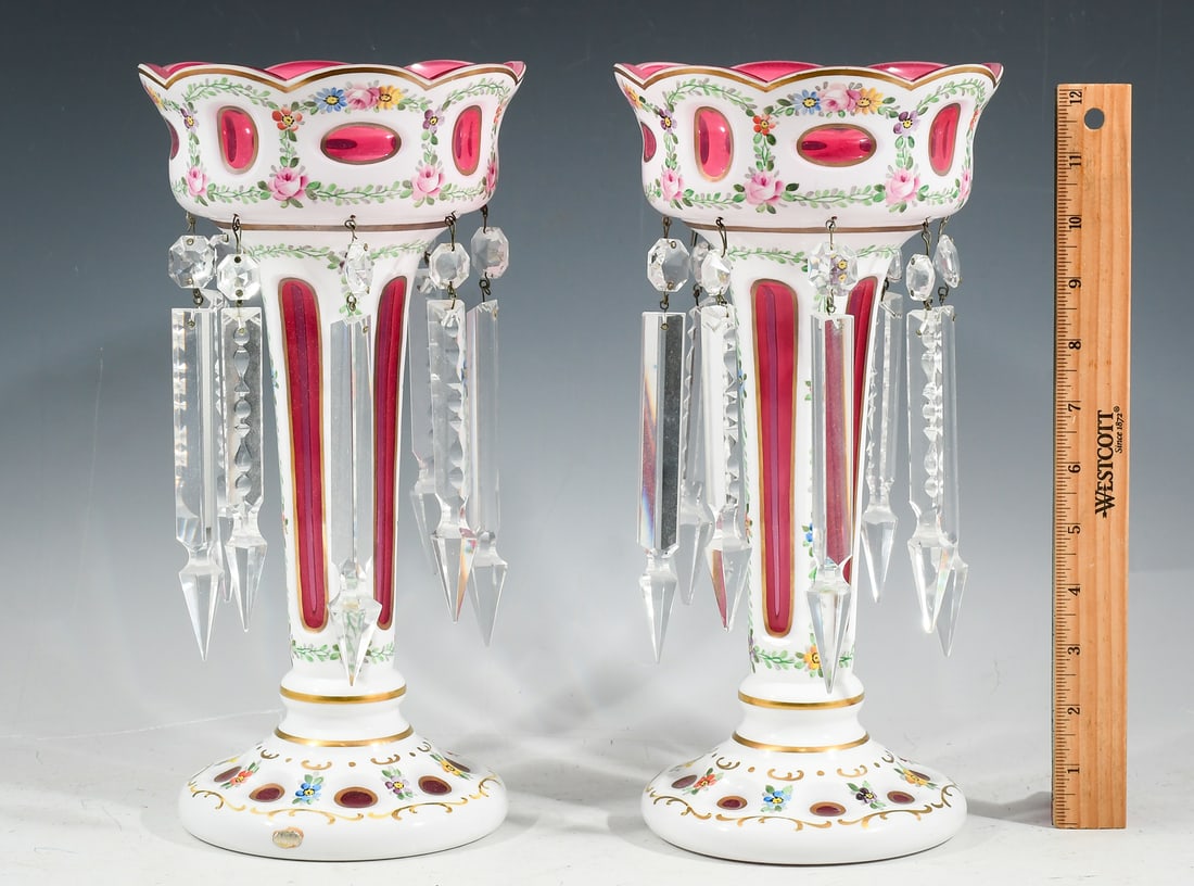 PAIR BOHEMIAN WHITE CUT-TO-CRANBERRY LUSTER: PAIR BOHEMIAN WHITE CUT-TO-CRANBERRY LUSTERS: White cut to Cranberry with enameled floral decoration. Adorned by Spear Crystal Prisms. Original Germany sticker at base of one. Holes at bottom for poss
