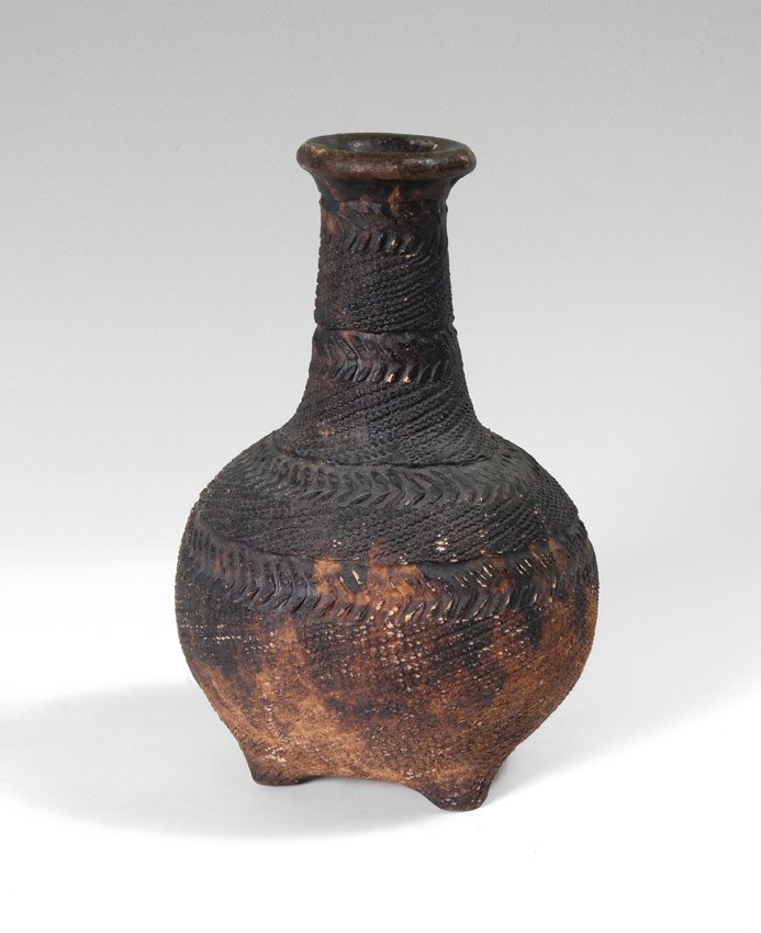CARVED AFRICAN NUPE TERRACOTTA VESSEL: CARVED AFRICAN NUPE TERRACOTTA VESSEL: Terracotta vessel or pot, Nupe Tribe, Nigeria. Incised geometric designs. 13'' h. x 8 1/4''.