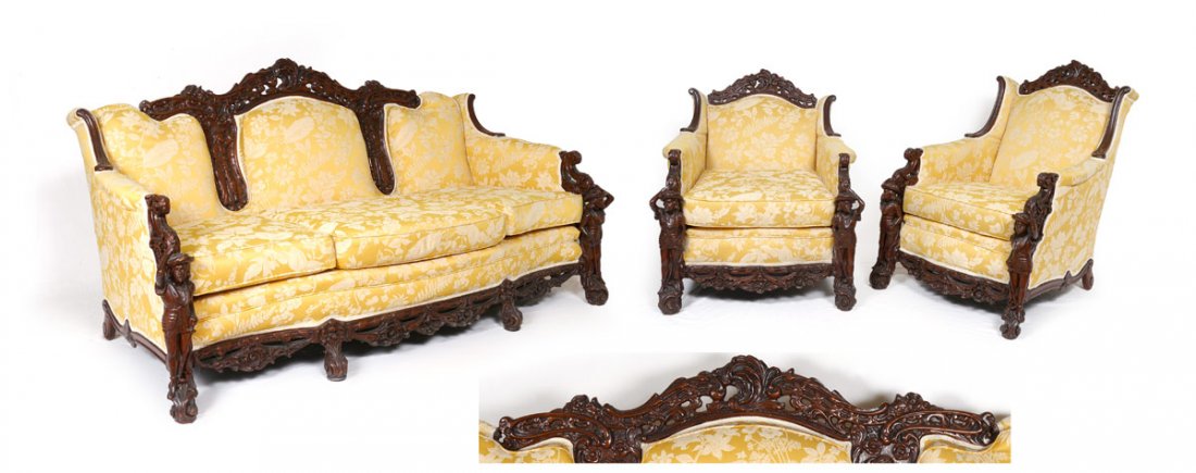3 PIECE FIGURAL CARVED PARLOR SET: 3 PIECE FIGURAL CARVED PARLOR SET: Profusely carved with figural conquistador or explorer arm supports on all, figural explorers on back of sofa. Patterned yellow upholstery. Sofa 40 1/2" h. x 79" x 4