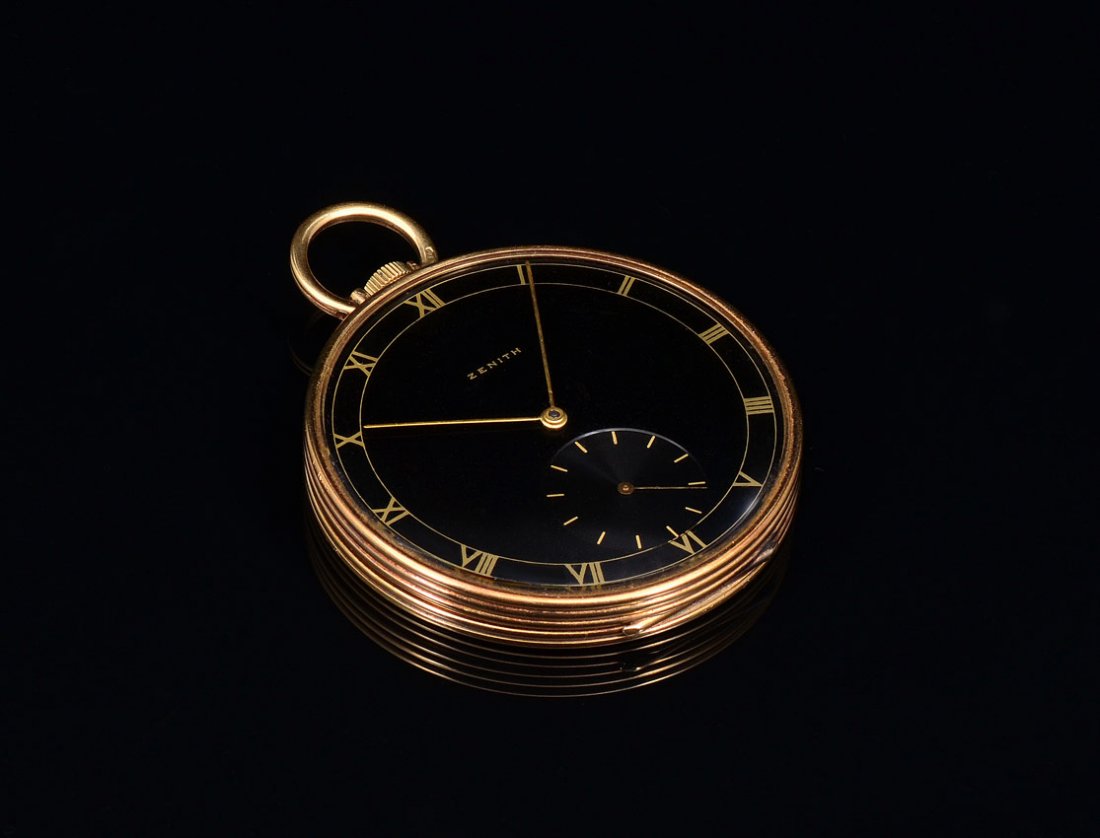 ART DECO 14K GOLD ZENITH POCKET WATCH: ART DECO 14K ZENITH POCKET WATCH: Early 1940s 14K yellow gold Zenith open face pocket watch. Triple signed dial, case and watch. The case is in the Deco Empire design. The dial is black with Roman num