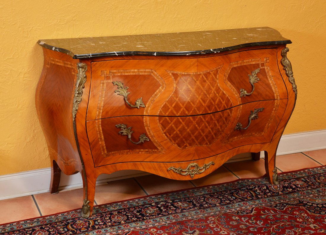 INLAID MARBLE TOP BOMBE CABINET: INLAID MARBLE TOP BOMBE CHEST: Shaped black variegated marble top, bombe 2 drawer chest with parquetry inlay all over. Applied ormolu decoration. Overall measures 35 1/2" h. x 59 1/2" x 22".