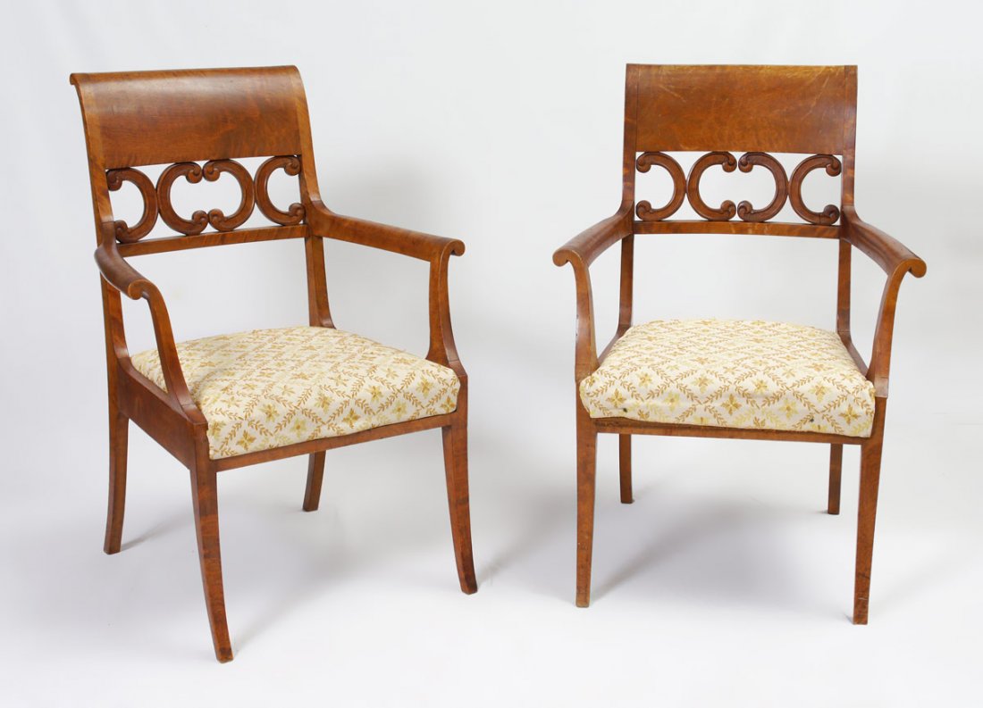 PAIR OF MAPLE SIDE CHAIRS: PAIR OF MAPLE SIDE CHAIRS: Carved and openwork back, outward scroll arm rests with shaped supports. Floral upholstered sheets. 38 1/2" x 27" x 24 1/2".