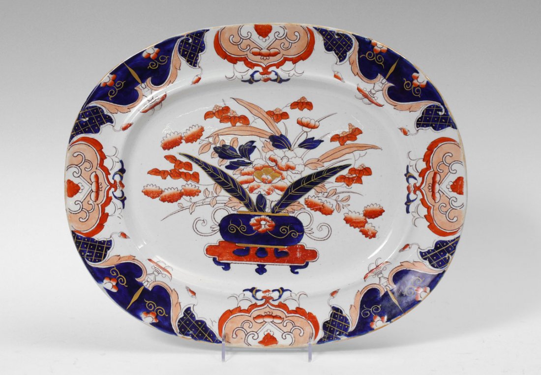 MASON'S IRONSTONE PLATTER: MASON'S IRONSTONE PLATTER: Flora and urn motif center, marked Mason's Patent Ironstone China. 17 1/4" x 14".