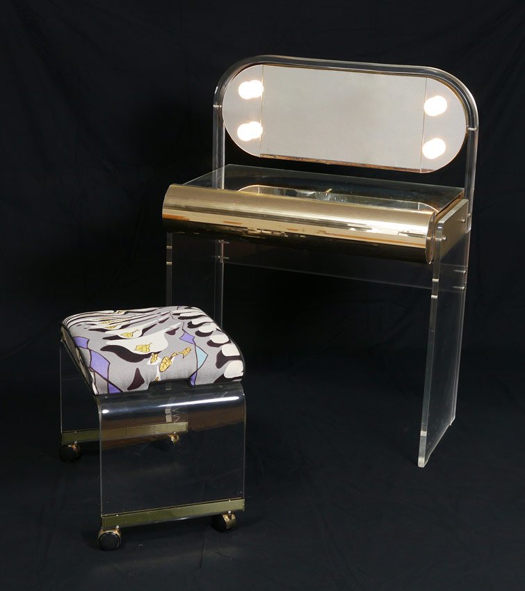 LUCITE VANITY & STOOL: LUCITE VANITY & STOOL: 2 pieces to include 1) Lucite frame vanity with lighted and articulated top mirror, top of vanity is mirrored as well. Single full length drawer with applied gold strips of plas