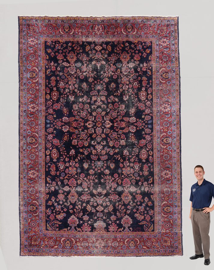 ANTIQUE PERSIAN PALACE SZ HK WOOL RUG 10'8"x15': ANTIQUE PERSIAN PALACE SIZE HAND KNOTTED WOOL CARPET, 10' 8" x 15' 4": This Persian Kashan rug has a midnight blue colored field that is covered with flower heads, buds, leaves, and palmettes, done in