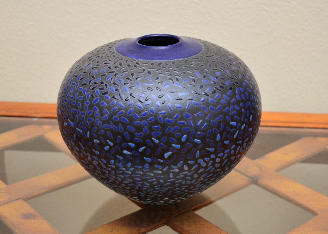 ROB MACKAY BLUE ART POTTERY VASE: ROB MACKAY BLUE STUDIO ART POTTERY VASE: Seed pot form vase with stippled design, signed on base Rob Mac Kay. Measures 6 3/4" h. x 8 3/4".