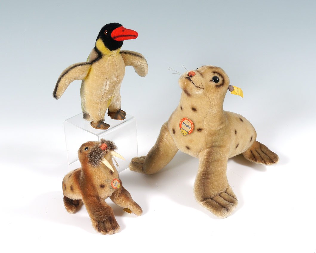 3 PIECE VINTAGE STEIFF SEAL, WALRUS, PENGUIN: 3 PIECE VINTAGE STEIFF SEAL, WALRUS, PENGUIN: 3 pieces total, all mohair with original buttons and tags. To include 1) ''Robby'' seal, tag number 4322, original name tag, 9 1/2'' h. x 10 1/2'' x 9 1/2
