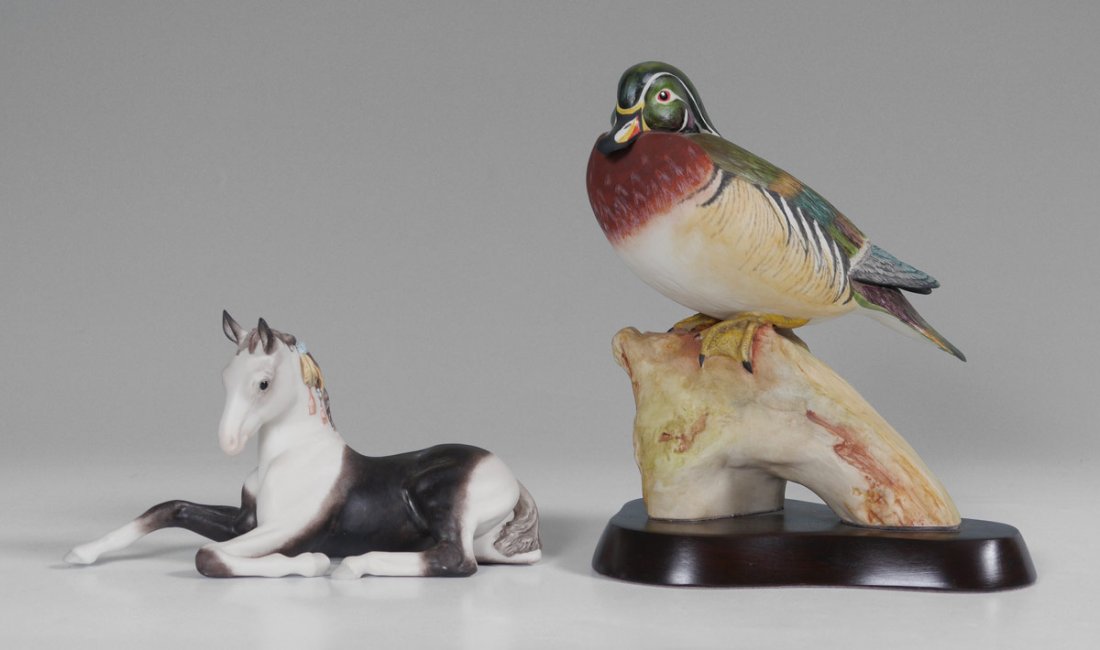 CYBIS WOOD DUCK AND PINTO COLT: CYBIS WOOD DUCK AND PINTO COLT: 2 piece Cybis figurines to include 1) Wood duck on wood plinth. Overall measures 9'' h. x 7 3/4'' x 6''. 2) Pinto Colt in repose, 4 1/2'' x 8 1/4'' x 3''.