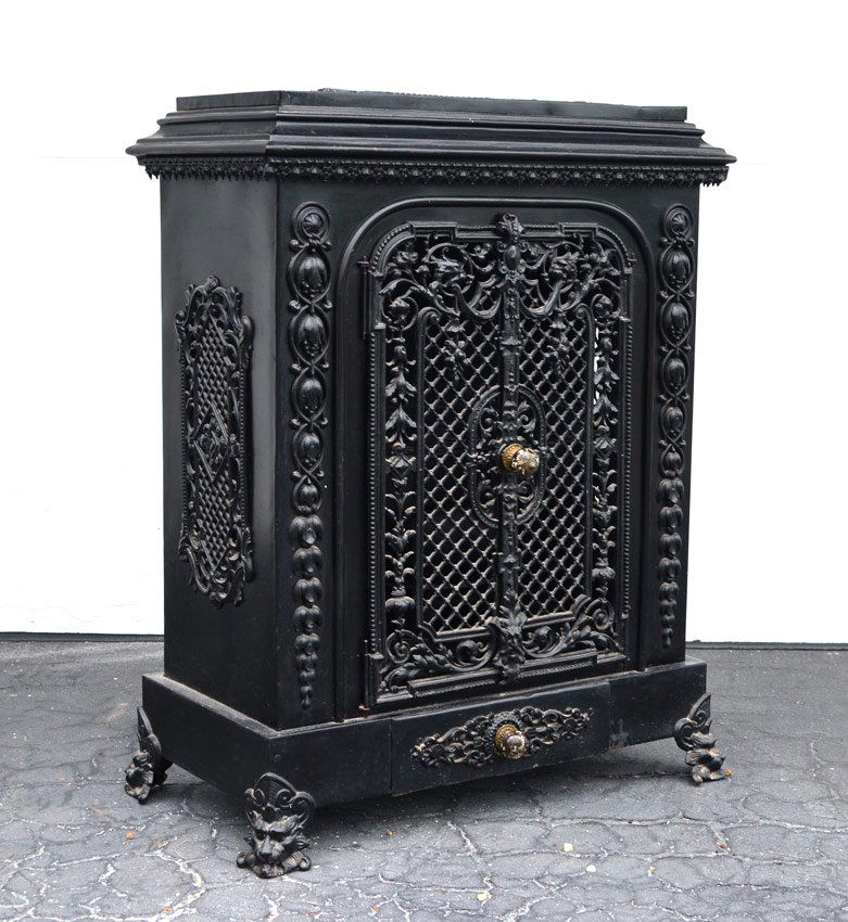 FRENCH CAST IRON STOVE: FRENCH CAST IRON STOVE: Japanned painted black finish, open work grates on top, sides and front doors. Porcelain knobs, single plate interior. Overall 37" h. x 30" x 16".