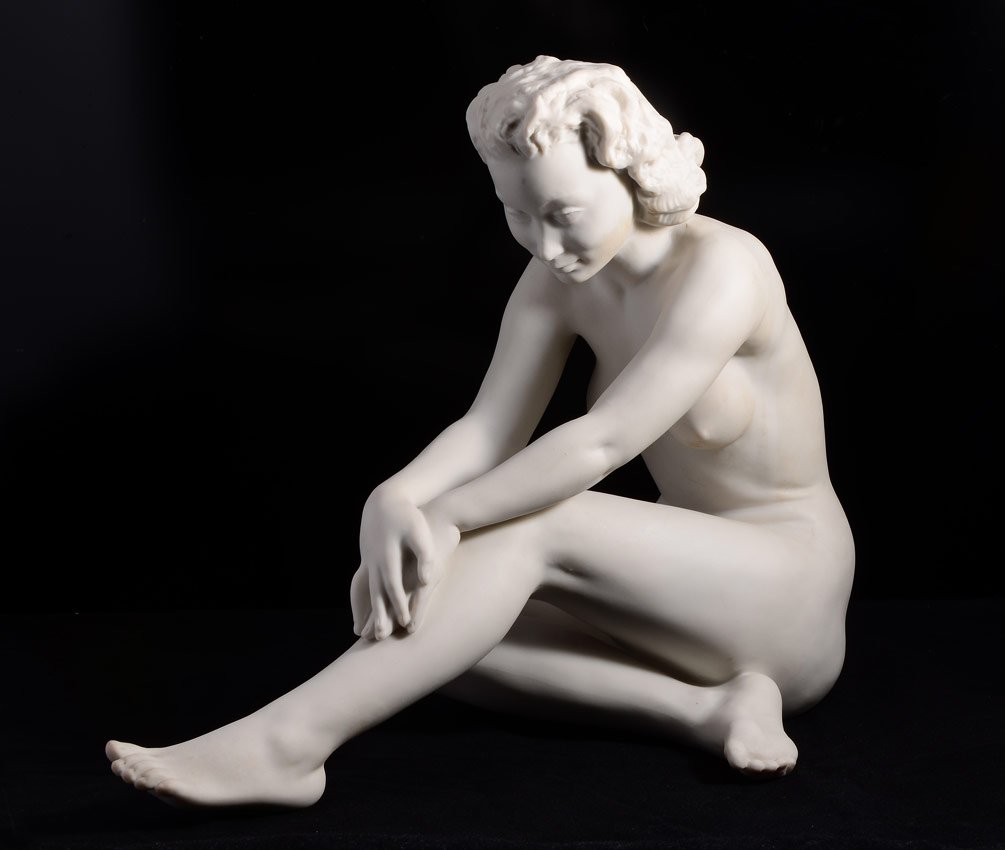 HUTSCHENREUTHER SEATED NUDE FIGURE: HUTSCHENREUTHER PARIAN SEATED NUDE FIGURE: Designed by C. Werner, marked on base. 9" h. x 11" x 6".