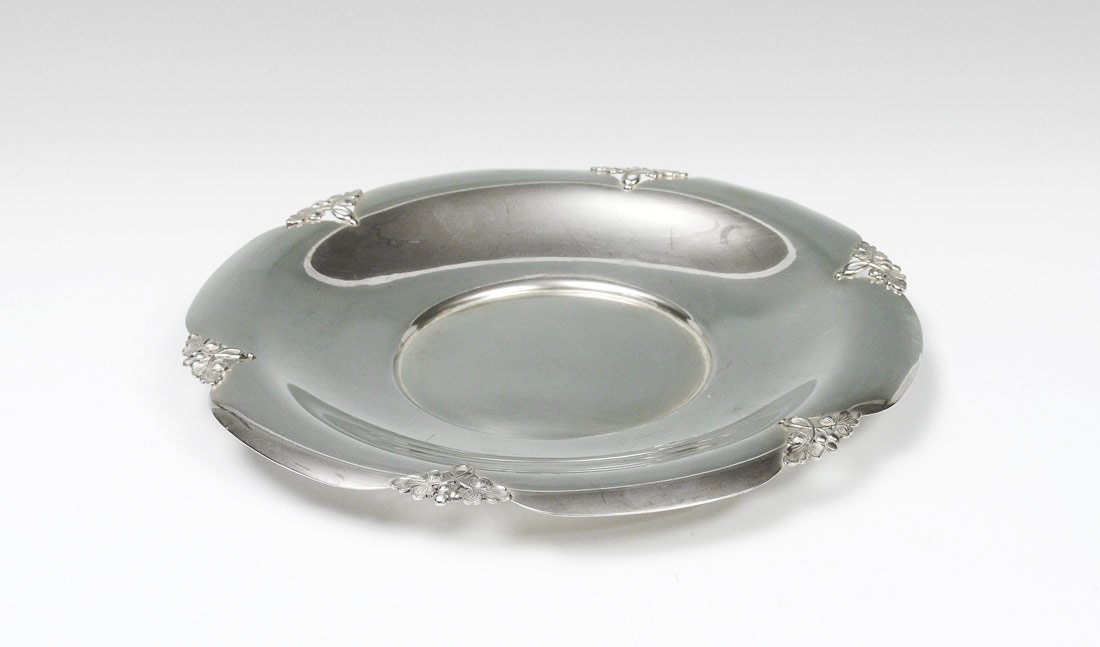 FRED HIRSCH STERLING ALEXANDRIA TRAY: FRED HIRSCH STERLING ALEXANDRIA TRAY: Serving tray in the Alexandria pattern by M. Fred Hirsch Co.. Shaped rim with reticulated grape and leaf design. Measures 12 1/2" dia., approx. 20.6 troy oz.