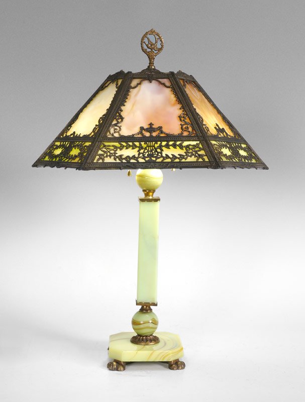 ONYX BASE SLAG GLASS LAMP: ONYX BASE SLAG GLASS LAMP: Base with green onyx and gilt metal sections, double socket fixture, measures 22 1/4" h. x 5 3/4" x 5 3/4". Sold with a 6 panel slag glass shade with filigree meta frame. Sh