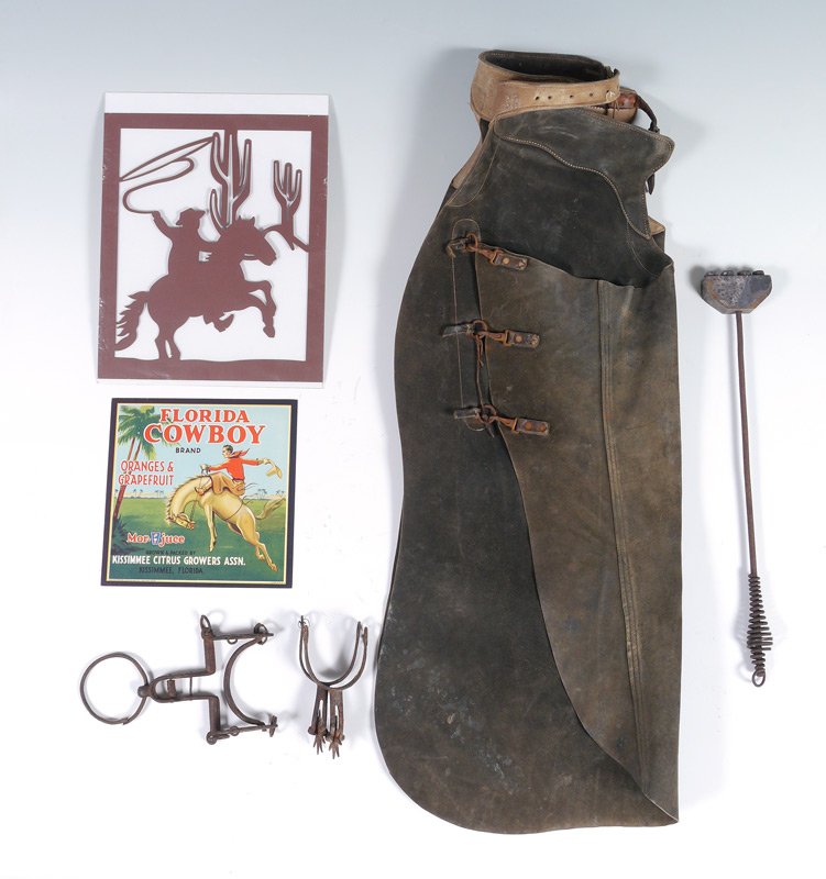 FLORIDA COWBOY COLLECTION: FLORIDA COWBOY COLLECTION: 7 pieces total to include 1) Pair of vintage leather chaps, belted. 34 3/4" long. 2) Cast iron stirrup, 10 1/2" l. x 6". 3) Pair of cast iron spurs, 6 1/4" long. 4) "BBCO" b