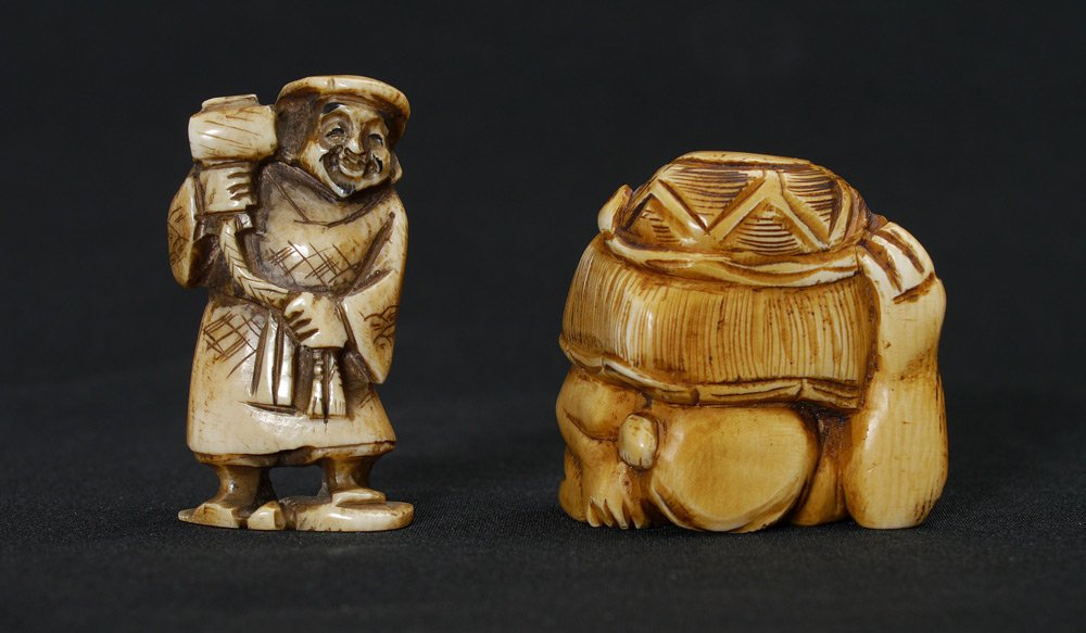 2 CARVED IVORY FIGURAL NETSUKE: 2 CARVED IVORY FIGURAL NETSUKE: 2 pieces total to include 1) Bulky crouching man supporting basket, signed, 1 5/8''. 2) Man holding hammer on rope, signed, 2'' h.
