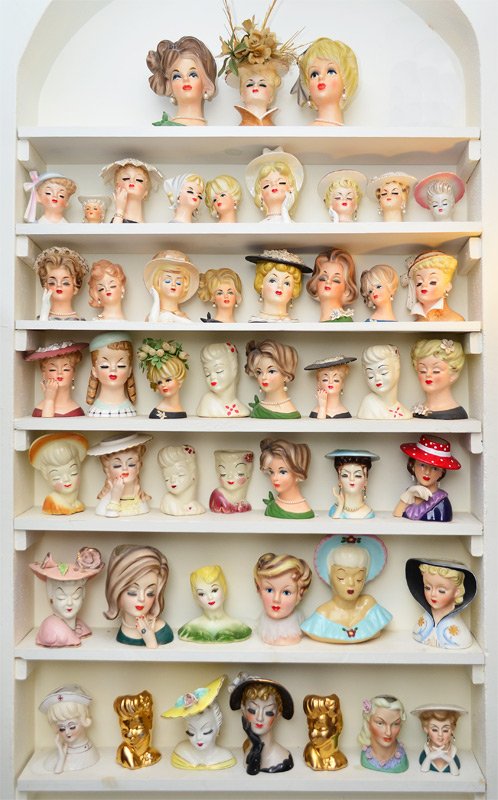 APPROXIMATELY 48 HEAD VASES: APPROXIMATELY 48 HEAD VASES: Assorted makers to include NapCoWare and Lefton; smallest is 3\"h., marked Japan and has a few chips; largest is 7 3/4\" and is also a wall pocket. Sold as is, as a lot.