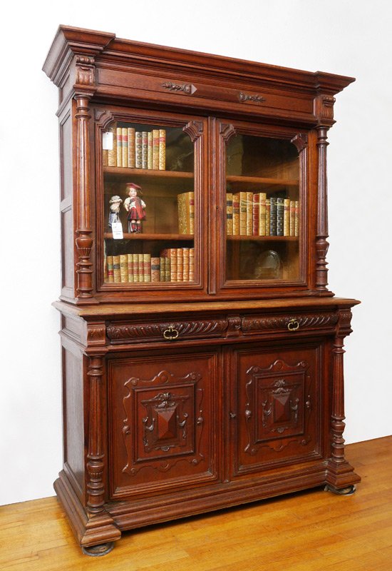 VICTORIAN CARVED SIDEBOARD: VICTORIAN CARVED SIDEBOARD: Top with shaped pediment and carved decoration, full fluted columns. 2 glass doors with 2 adjustable shelves. Base with 2 drawers over 2 carved panel doors with single shel