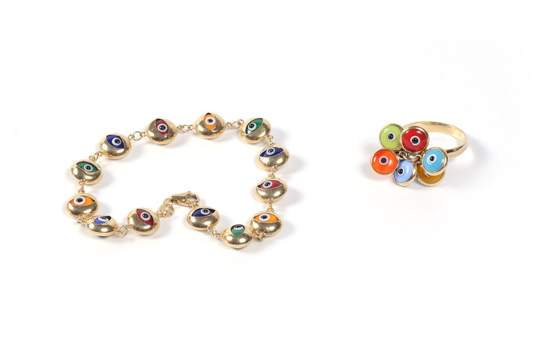 14k GOLD MULTI COLORED GLASS BRACELET & RING SET: 14K 'EYE' BRACELET AND RING SET: 14K yellow gold ring and bracelet with multi colored glass "eyes". Ring is a size 7.5 The bracelet 7" with lobster claw clasp. Gold Weight: Approx. 8.0 grams.