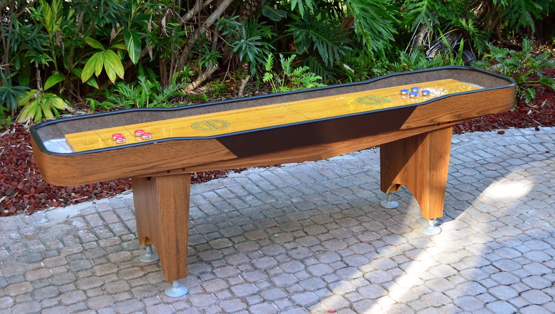 9' CHAMPION TABLE TOP SHUFFLEBOARD GAME: 9' CHAMPION TABLE TOP SHUFFLEBOARD GAME: Appears to be from the Qualifier series, retails for up to $3000 new. Maple playfield, oak veneer cradle. 34 1/2" h. x 110" x 24 1/2"