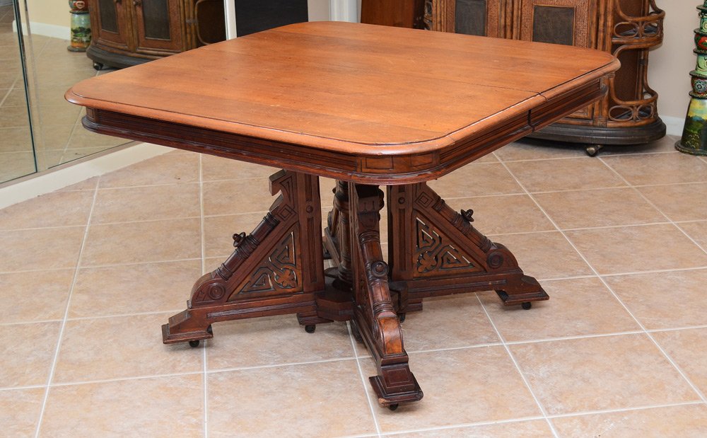 JACOBEAN STYLE EXTENSION DINING TABLE WITH 5 LEAVES: JACOBEAN STYLE EXTENSION DINING TABLE WITH 5 LEAVES: Walnut table with carved legs and floating pedestal for extra support. Table measures 30'' high x 45'' x 105'' fully extended. The leaves are 12''.