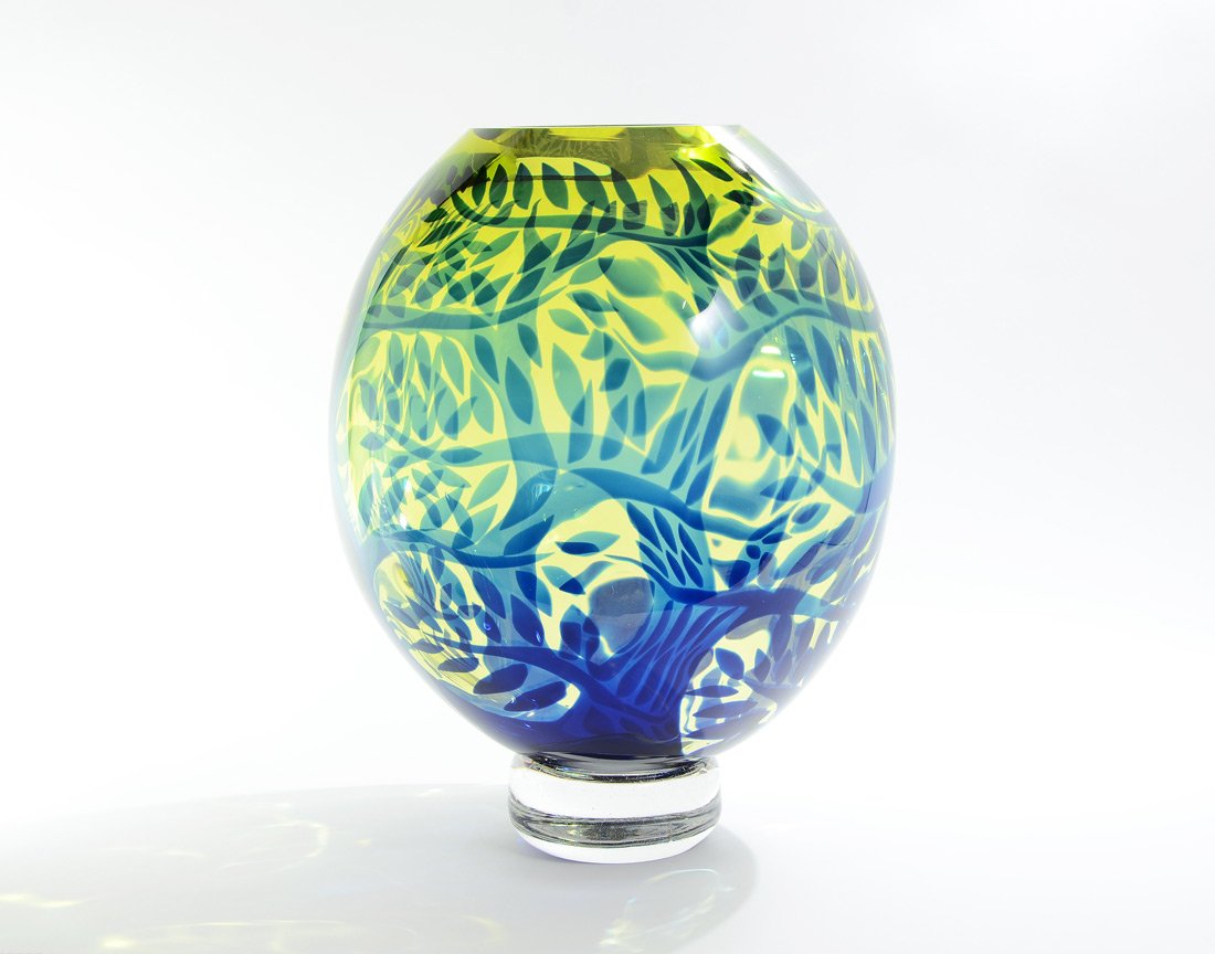 LARGE DUNCAN McCLELLAN ART GLASS VASE: McCLELLAN, Duncan, (American, 1955-): Heavy green / yellow glass with blue trees and leaves, signed on clear base. 17 1/4'' h. x 12 1/2'' dia.