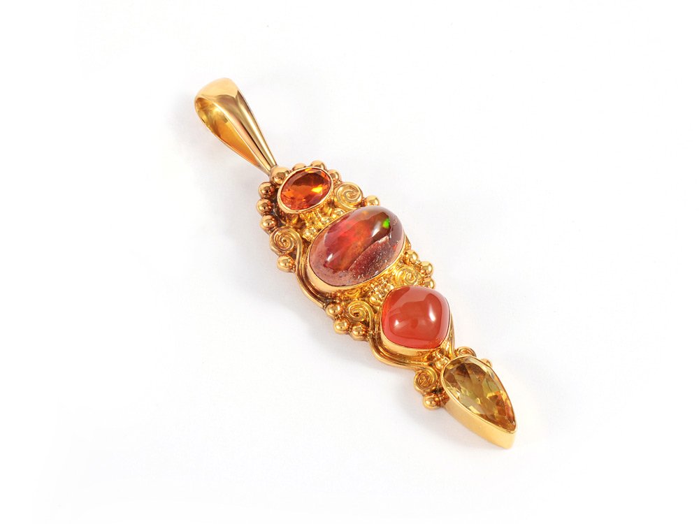 SAJEN 18K GOLD GEMSTONE PENDANT: SIGNED SAJEN 18K OPAL CARNELIAN AND CITRINE PENDANT: The four gemstones are a .60 Ct faceted transparent opal, a .60 Ct red orange oval cabochon opal, a sugarloaf cabochon carnelian and a pear shaped 