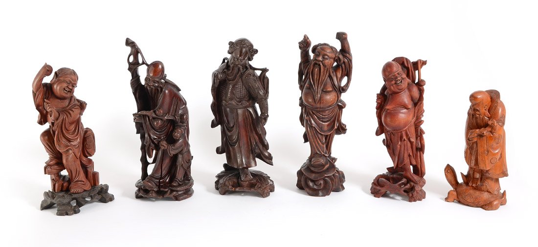 6 LARGE ORIENTAL WOOD CARVINGS: 6 LARGE ORIENTAL WOOD CARVINGS: 6 assorted Oriental gods or immortal figures. Tallest measures 12 1/4'' h. x 4 1/2'' x 3 3/4''.