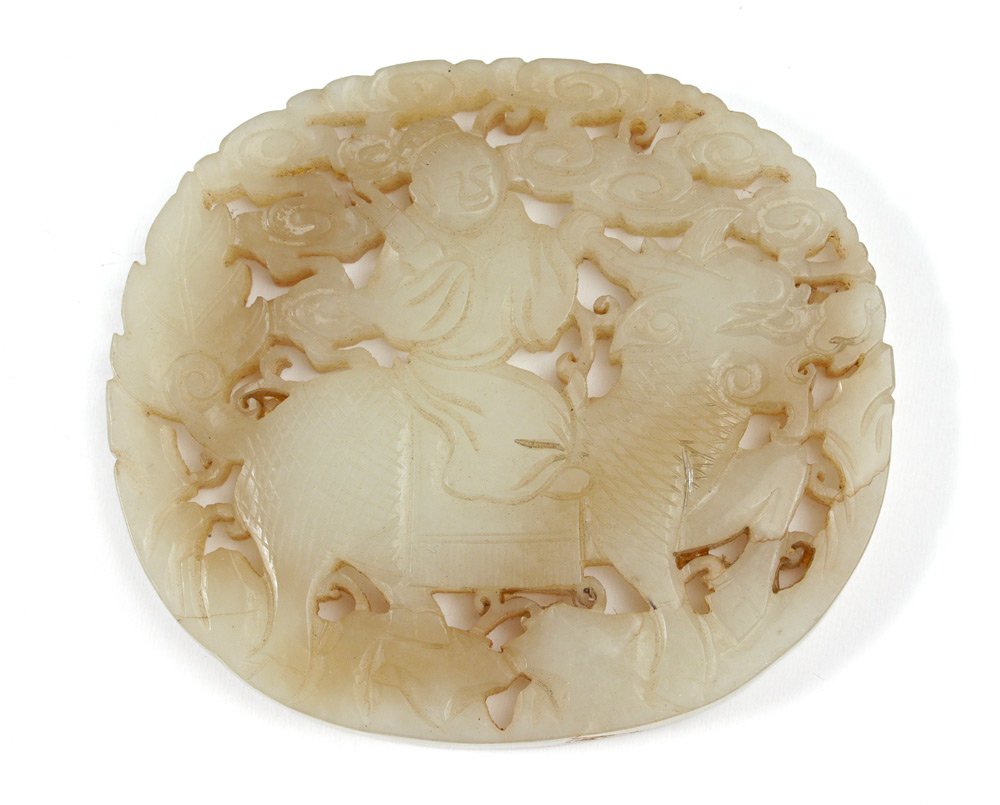 ORIENTAL CARVED JADE MEDALLION: ORIENTAL CARVED JADE MEDALLION: Pierce carved with clouds above man riding mythical horse. Measures 2 7/8'' x 3 1/4''. Actual age unknown.