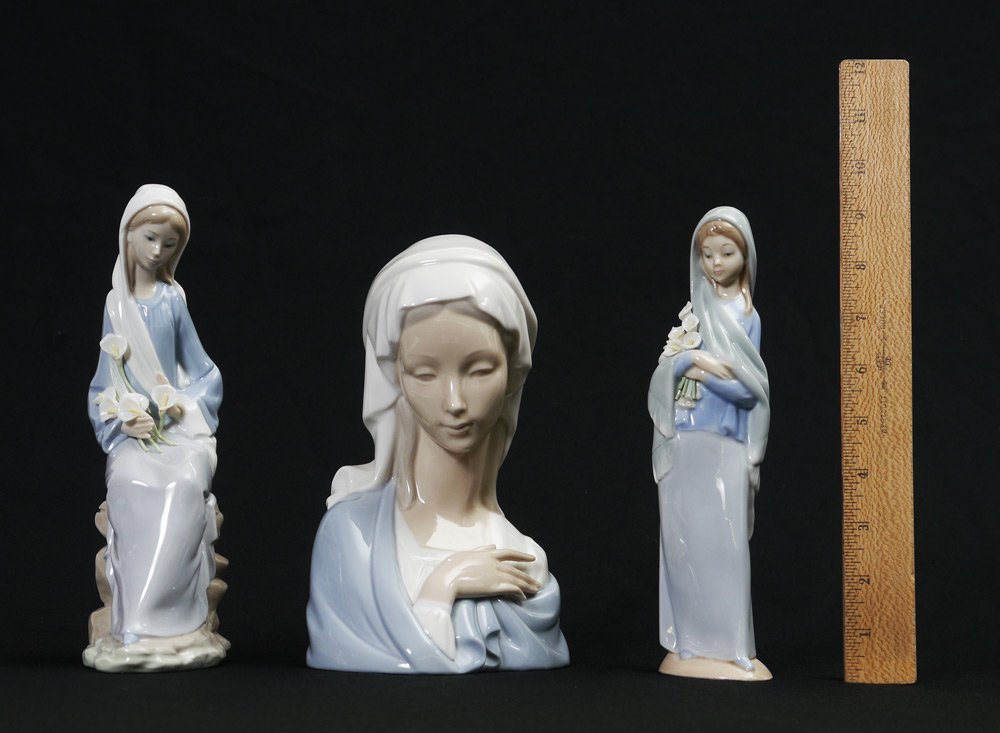 LLADRO MADONNA HEAD AND CALLA LILY GIRLS: 3 LLADRO PORCELAIN FIGURINES: 1) GIRL WITH LILIES SITTING 4972, Jose Javier Malavia sculptor, issued 1977 retired 1991, 9.5''h. Most calla lilies have chips. 2) MADONNA HEAD 4649, Vincente Martinez sc