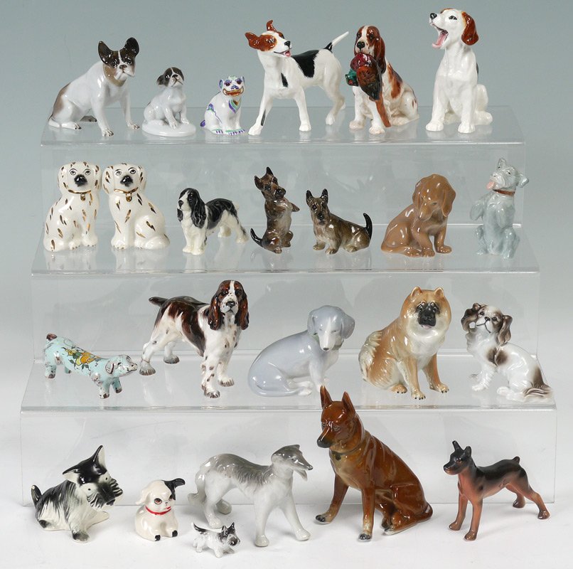 DOG FIGURES ROSENTHAL DOULTON WADE ETC: LARGE ESTATE COLLECTION OF DOG FIGURINES: To include, Rosenthal dog H280, puppy 727 & Foo Dog; Royal Doulton HN 1029, HN1099, HN1100; pair Staffordshire dogs with crazing; Royal Worcester spaniel 2944