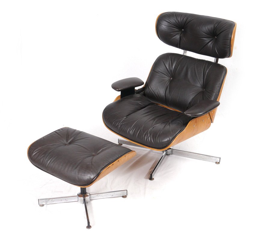 SELIG LOUNGE CHAIR & OTTOMAN: SELIG LOUNGE CHAIR & OTTOMAN: Eames style black leather and bent wood, chair measures 39 1/4" h. x 32" x 31", ottoman 15 3/4" h. x 21 1/2" x 17 1/2". Selig is located in Leominster, Massachusetts.