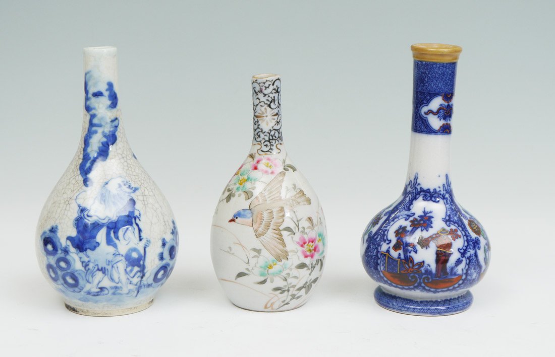COLLECTION OF 3 ORIENTAL EARTHENWARE VASES: COLLECTION OF 3 ORIENTAL EARTHENWARE VASES: 3 pieces total to include 1) Chinese Xuantong marked blue and white decorated vase with mythical elder standing. 7 3/8" h. x 4". 2) Unmarked blue and white