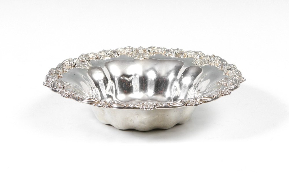 BLACK STARR & FROST EMBOSSED STERLING SERVING BOWL: BLACK, STARR & FROST EMBOSSED STERLING SERVING BOWL: Embossed rim with rococo foliate scroll, fluted body, monogrammed center. Marked on base Black, Starr & Frost, New York, Sterling, 4258A, 10 1/2 In
