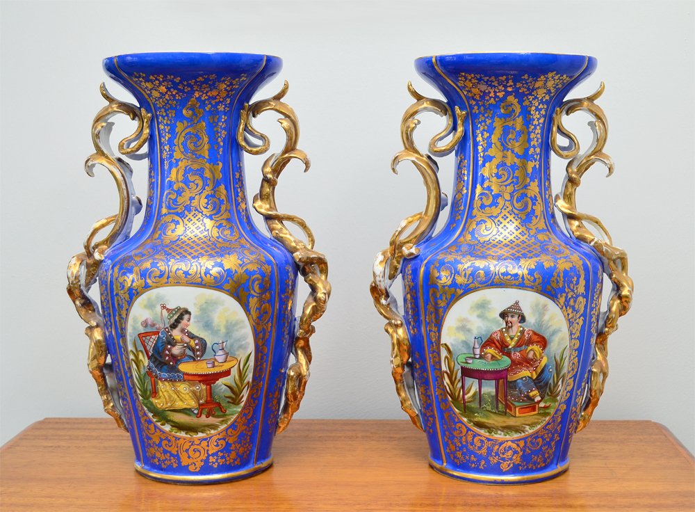 PAIR OLD PARIS PORCELAIN VASES: PAIR OLD PARIS PORCELAIN VASES: Each with hand painted Orientalist at tea in garden scene, blue ground with gilt decoration, applied foliate handles. Unmarked, felt applied to bottoms. Overall measure