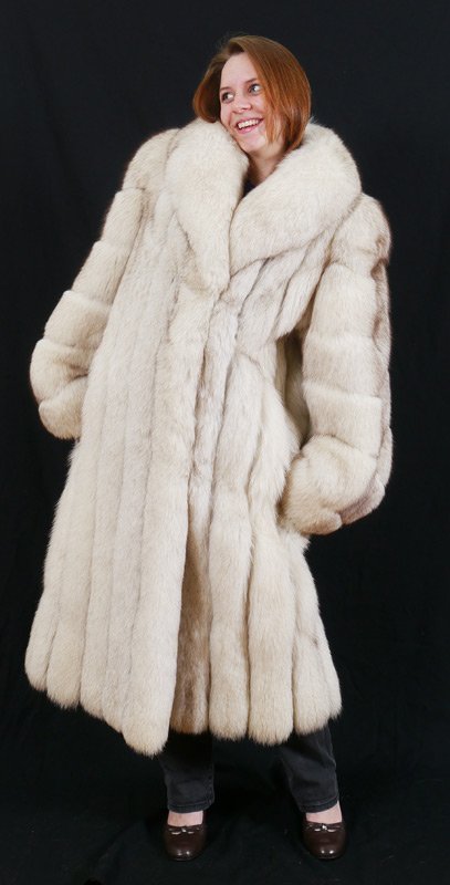 SAGA SILVER FOX FUR COAT: SAGA SILVER FOX FUR COAT: Fully lined with leather trim at cuffs and pockets, approximate size XL, shoulders approx. 20", 52"l.