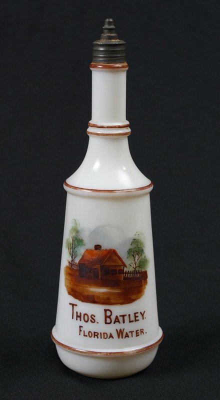 FLORIDA WATER MILK GLASS BARBER BOTTLE: MILK GLASS FLORIDA WATER BARBER BOTTLE: Hand painted decoration, personalized with name. Measures approx. 10". From the William Merner Collection.
