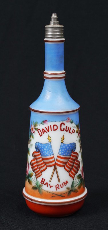 GRAND OLD FLAG MILK GLASS BARBER BOTTLE: MILK GLASS FLAG DECORATED BARBER BOTTLE: Hand painted decoration, personalized with name. Measures approx. 10". From the William Merner Collection.