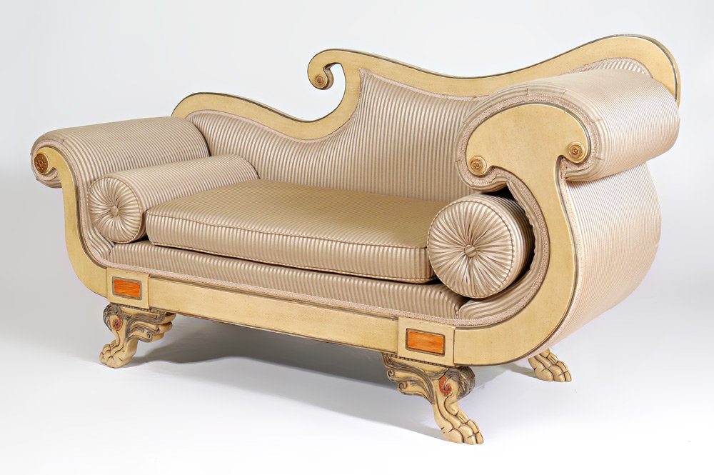 FRENCH EMPIRE STYLE CARVED SETTEE: CARVED FRENCH EMPIRE SETTEE: Sweeping scroll back and arms on 4 carved paw feet. Striped upholstery. Painted finish. 38'' h. x 69 1/2'' x 24 3/4''.