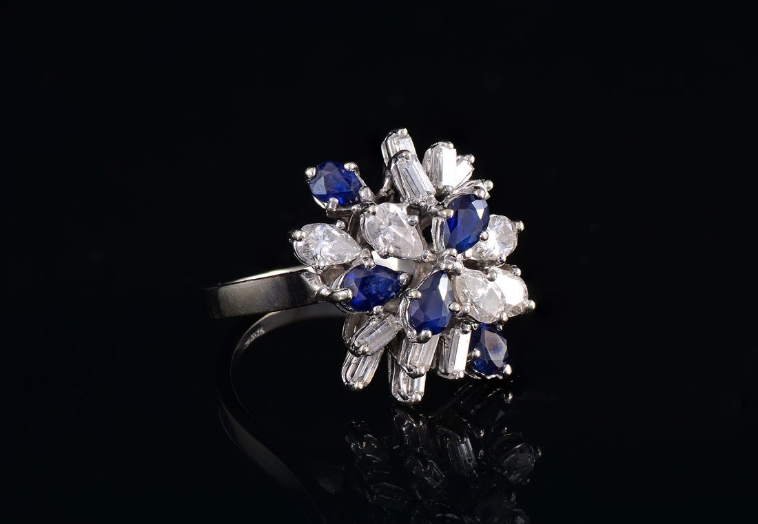 18K DIAMOND & SAPPHIRE COCKTAIL RING: IMPRESSIVE 18K DIAMOND & SAPPHIRE DINNER RING: The 5 pear brilliant and 10 baguette VS diamonds total approx. 1.35 Ct. The 5 pear shaped sapphires total approx. 2 Ct. are also VS. The diamonds are G-H