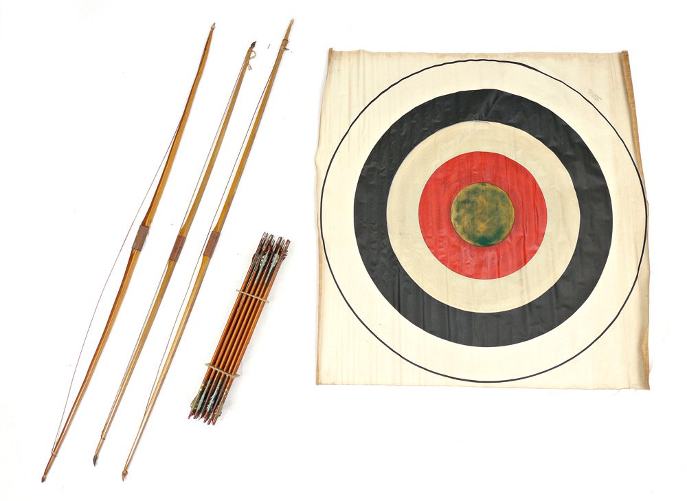 EARL GRUBBS VINTAGE LONG BOWS, ARROWS, & TARGET: EARL GRUBBS VINTAGE LONG BOWS, ARROWS, & TARGET: Circa 1930's to include 3 long bows and large target, still in original shipping crate, 75 1/2'' x 5'' x 3''. Sold with 24 wood shaft bows of varying l