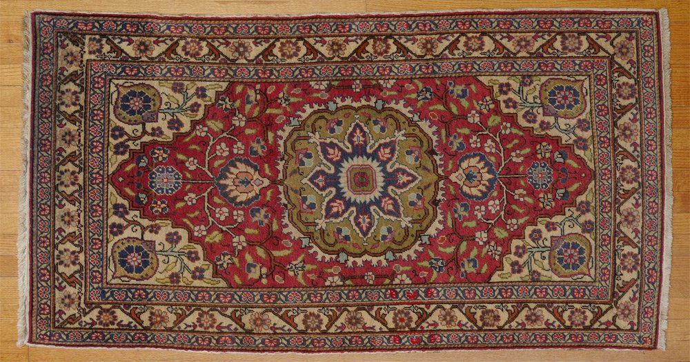 SEMI-ANTIQUE TURKISH HAND KNOTTED WOOL RUG 3'x5': SEMI-ANTIQUE TURKISH HAND KNOTTED WOOL RUG, 3' X 5' 3'': This rug has a large round pistachio green colored medallion with a deep blue, white, and red, star center. There are spandrels hanging from ei