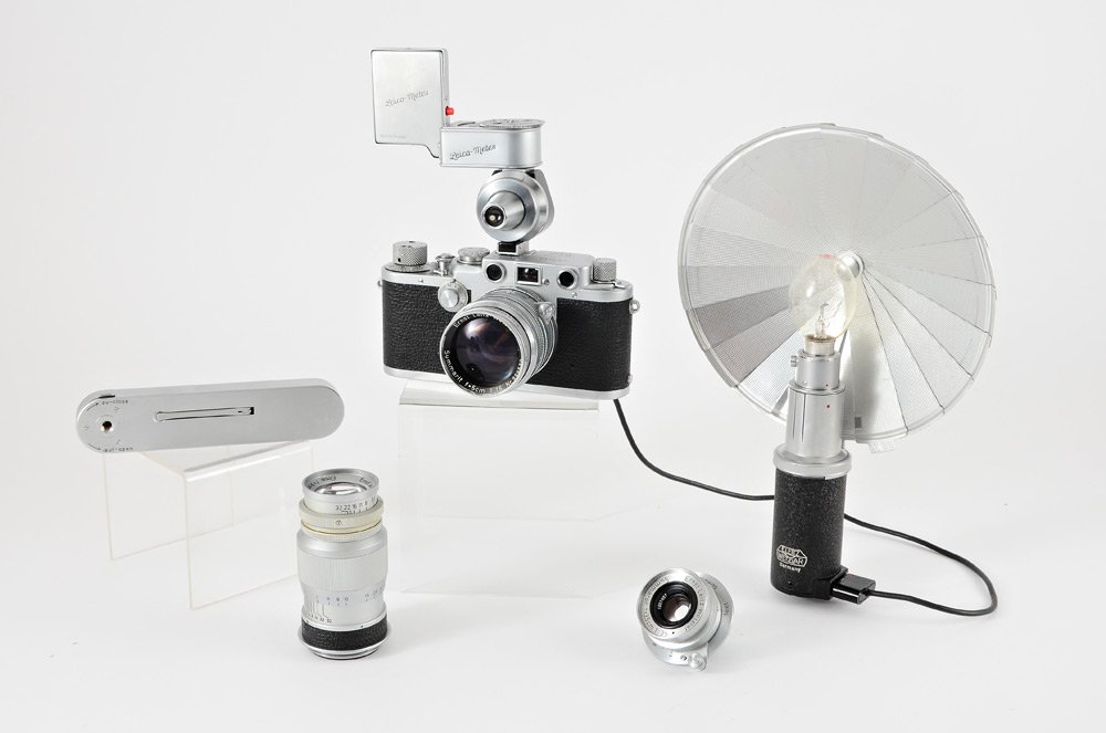 LEICA IIIF CAMERA WITH 3 LENSES & MORE: LEICA IIIF CAMERA WITH 3 LENSES & MORE: Date of Manufacture for lenses and body is 1952. Top include chrome Leica IIIF Rangefinder body serial number 626587 with leather sleeve, Summarit f=5cm 1:1.5 l