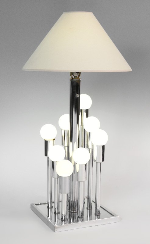 9 LIGHT MODERNE TABLE LAMP: 9 LIGHT MODERNE TABLE LAMP: Chrome & mirror base with 8 lights of ascending levels surrounding a central light. Overall 38" h. x 13" x 13". Sold with shade for center light, 11" x 20 1/4".