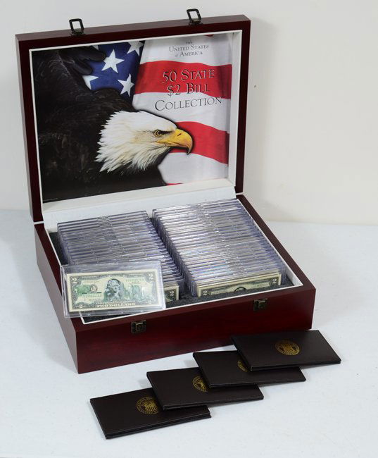 BOXED SET "50 STATE TWO DOLLAR BILL COLLECTION": BOXED SET 50 STATE TWO DOLLAR BILL COLLECTION: All 50 states represented on $2 bills slabbed in plastic, with an additional 4 Florida bills in bill folds. Sold in wood presentation box, 5 1/4" h. x 17