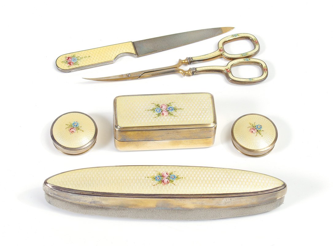 1920'S GUILLOCHE ENAMELED MANICURE SET: 1920'S GUILLOCHE ENAMELED MANICURE SET: 6 piece with ivory colored and floral decorated guilloche enamel decoration to include nail file (4 1/2''), nail scissors marked F. Koeller Co., Germany (4 3/8'