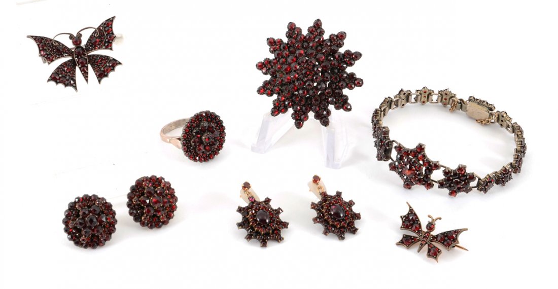 VINTAGE ESTATE GARNET JEWELRY: BOHEMIAN GARNET JEWELRY GROUP: Estate fresh group to include link bracelet (7"), set of 2 butterfly pins (1 1/2" and 1" span), size 6.5 ring with matching earrings, a star burst brooch (1 5/8"), and p