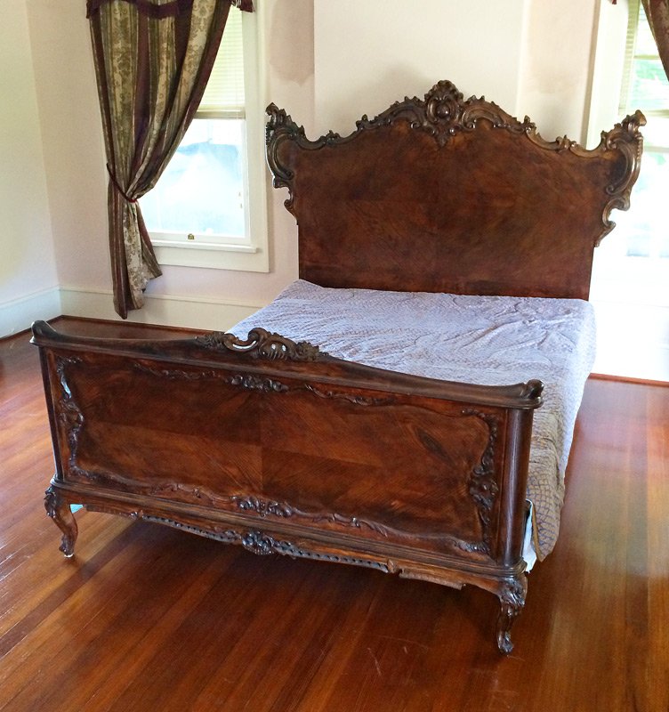 VICTORIAN CARVED WALNUT BED: VICTORIAN CARVED WALNUT BED: Both head board and foot board with carved crests and shaped size. Head board 58" h. x 71 3/4" x 4", foot board 35" h. x 60", rails 83".