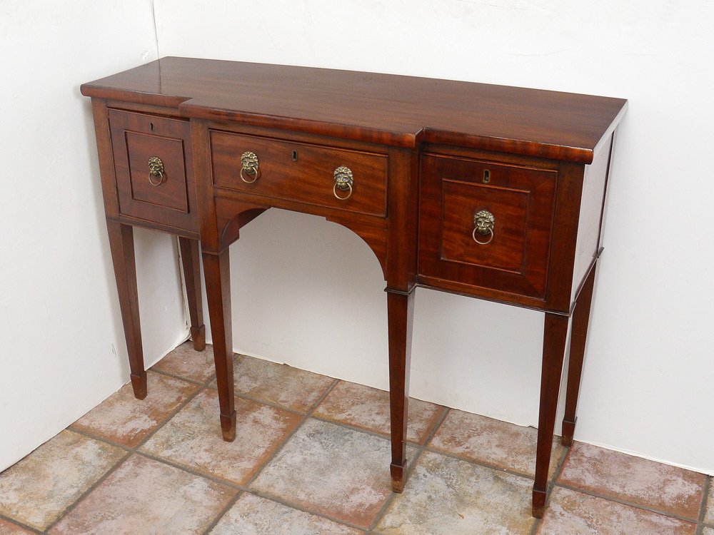 DIMINUTIVE ENGLISH MAHOGANY SIDEBOARD CA. 1850: DIMINUTIVE ENGLISH MAHOGANY SIDEBOARD CA. 1850: Left side is door opening to set back shelf, center is drawer and right is deep drawer. 32.75''h. x 43.25''w, 14.25'' deep at center.